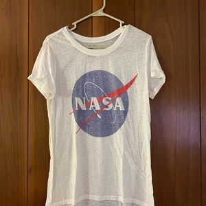 White NASA shirt.